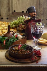 red wine and meat stewed in a sauce with hot pepper and pomegran