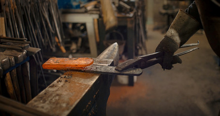 Rod hot iron on the anvil.