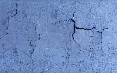 Blue potreskany old metal background. Corrosion of metal. Vintage. Cracks, blisters old blue paint.
