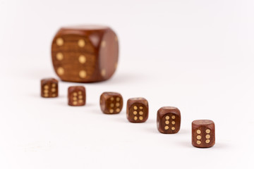 Dices in selective focus over white background