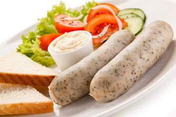 Easter breakfast - eggs, boiled white sausages and vegetables