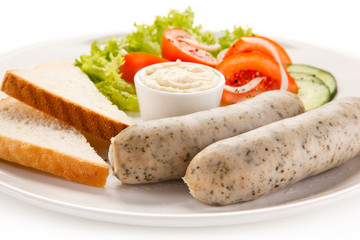 Easter breakfast - eggs, boiled white sausages and vegetables