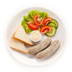 Easter breakfast - eggs, boiled white sausages and vegetables