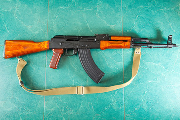 Kalashnikov AK-47 on a green background