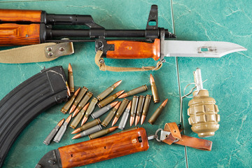 Kalashnikov AK-47 on a green background