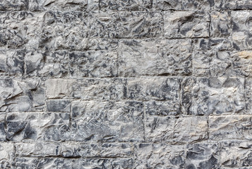 Ancient stone wall. Monochrome grey texture. Can be used as background