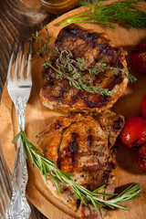 Delicious beef steaks on wooden table