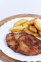 Two pork chops with french fries