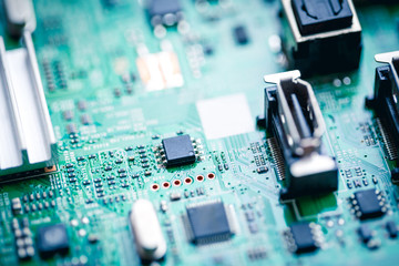 Close up on computer motherboard with microprocessor.