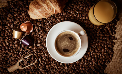 Shot Of Coffee And Croissant On Table