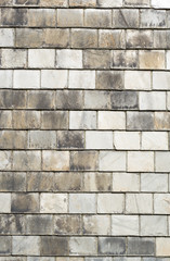 Rows of old gray roof slates close up.