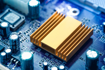 Close up on computer mother board with radiator.