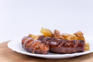 Served meal with sausages and french fries