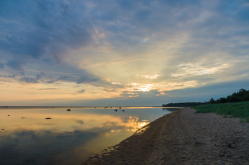 Calm and colourful sunrise at sea coast
