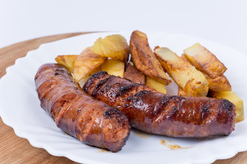 Served meal with sausages and french fries