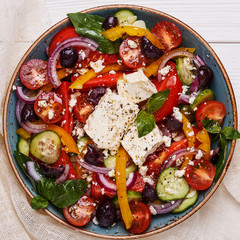 Greek salad with fresh vegetables, feta cheese, black olives