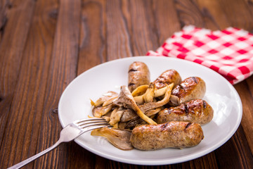 sausages and mushrooms on a plate