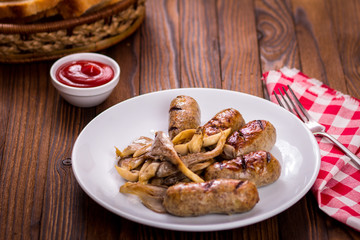 sausages and mushrooms on a plate