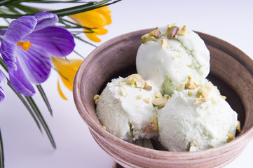 Pistachio ice cream in an earthenware bowl