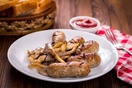 sausages and mushrooms on a plate
