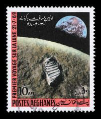 Obraz premium Stamp printed in the Afghanistan shows First Moon Landing - 1969, circa 1970.