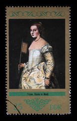 Stamp printed in GDR (East Germany) shows picture Lady in White with the inscription Lady in White, by Tizian from the series Paintings, circa 1973