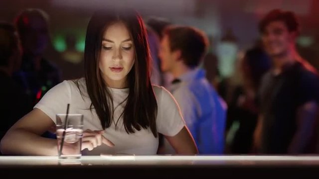 Young woman typing in phone