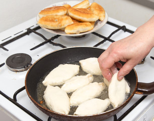 Food patties in a frying pan