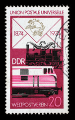 Stamp printed in GDR shows Old Steam Locomotive and Modern Diesel, Centenary of the UPU, circa 1974