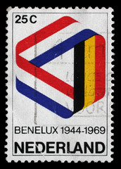 Stamp printed in the Netherlands shows Mobius Strip in Benelux Colors, 25th Anniversary of the...