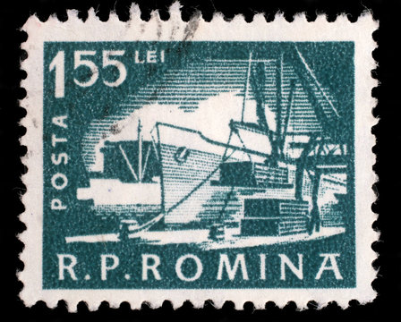 Stamp printed in the Romania, shows the loading of the ship in port, circa 1960