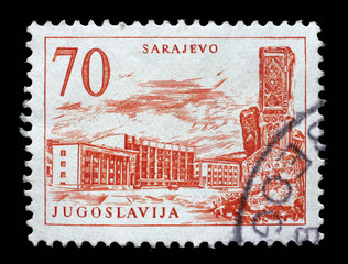 Stamp printed in Yugoslavia shows Sarajevo railway station and obelisk, Bosnia and Herzegovina, circa 1958.
