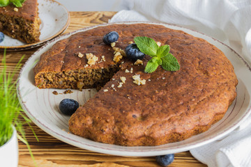 Banana bread with blueberries on a wooden table