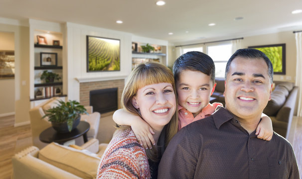 Young Mixed Race Family Portrait In Living Room Of Home