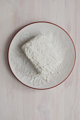 Cottage cheese on round white plate