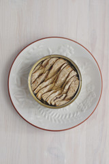 Canned sprats on round dish