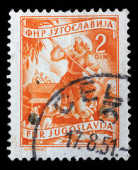 Stamp printed in Yugoslavia shows woman to harvest sunflowers, domestic economy series, circa 1952