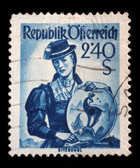 Stamp printed in Austria shows image woman in national Austrian costumes, Kitzbuhel, series, circa 1951