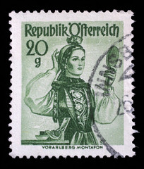 Stamp printed in Austria shows image woman in national Austrian costumes, Vorarlberg, Montafon Valley, series, circa 1948