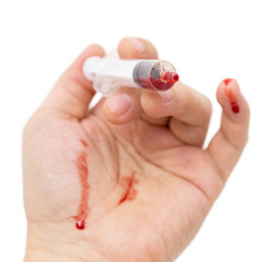 syringe in hand on white background
