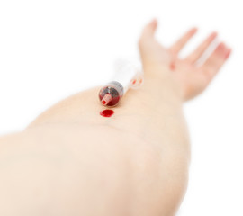 syringe in hand on white background