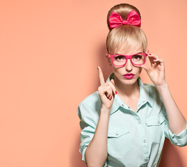 Hipster girl in stylish glasses thinking, idea
