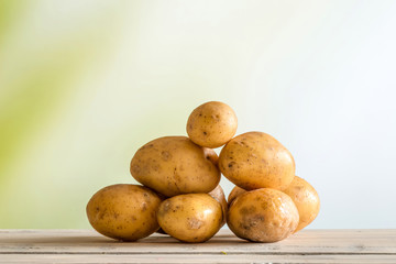 Potatoes on a wooden table
