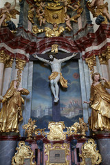 Fototapeta na wymiar Altar of the Holy Cross, parish Church of the Immaculate Conception of the Virgin Mary in Lepoglava, Croatia