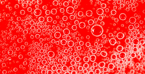 drops of honey on a red background