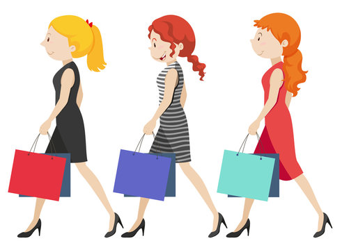 Three women walking with shopping bags