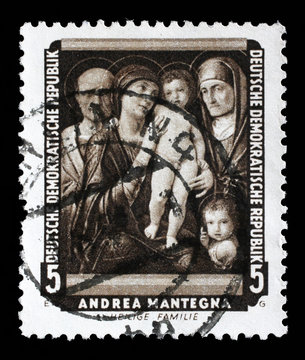 Stamp printed in DDR shows the painting Holy Family, by Andrea Mantegna , from the series Famous Paintings from Dresden Gallery, circa 1957.