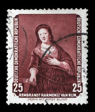 Stamp printed in DDR shows the painting Saskia with red flower, by Rembrandt, from the series Famous Paintings from Dresden Gallery, circa 1957.