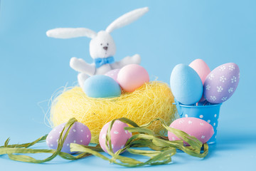 Easter eggs in bowl on table with copy space