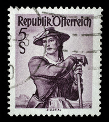 Stamp printed in Austria shows image woman in national Austrian costumes, Ziller Valley, series, circa 1948